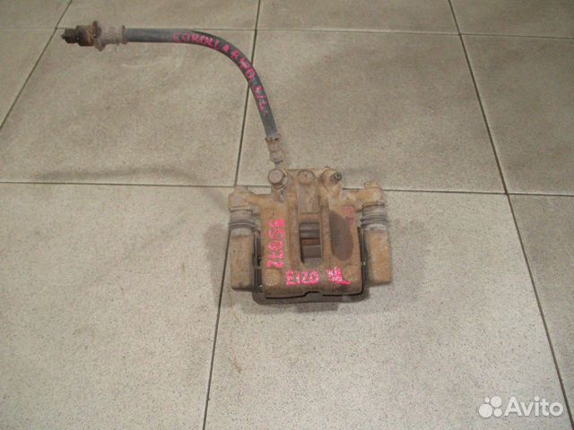 Суппорт задний левый Toyota Corolla (E120) 2000-2