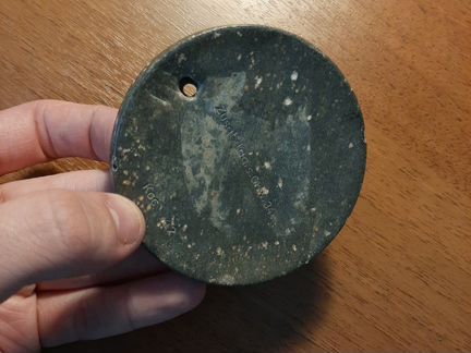 Немецкая банка, пробитая осколком